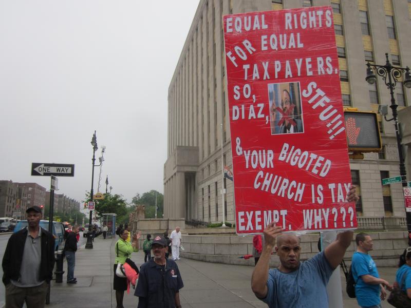 As demonstrators approached the Grand Concourse, they were greeted by Carlos Archie, a supporter of same-sex marriage